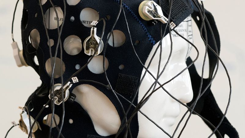 a photo of a cap with electrodes that is used to measure brain activity